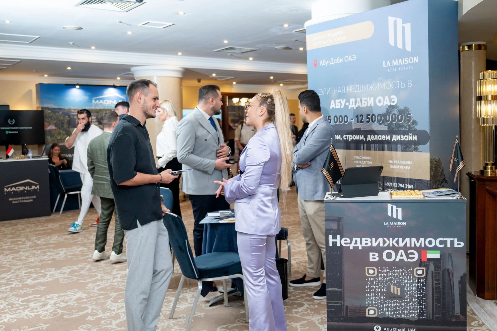 The La Maison team meeting buyers at a property exhibition, photograph 1