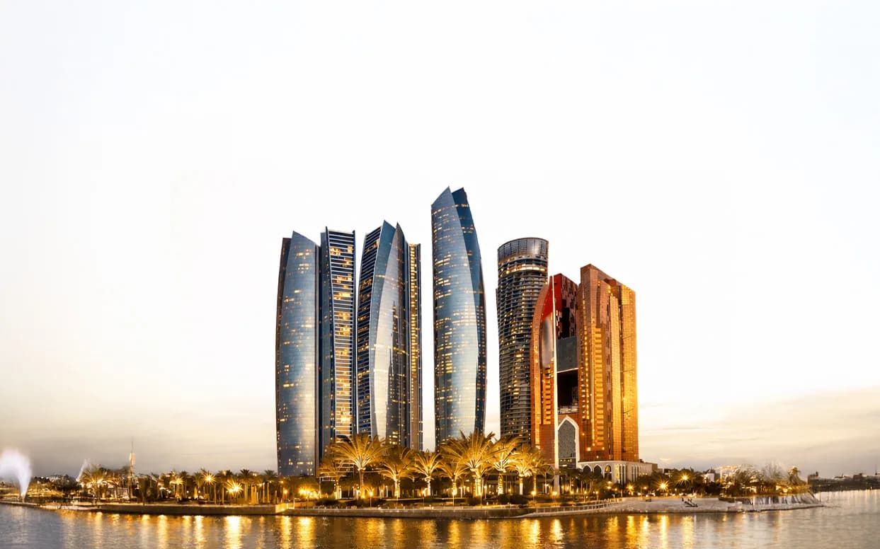 The Abu Dhabi skyline at dusk, seen from the Corniche